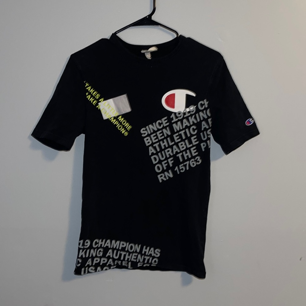Black champion shirt with gray & yellow writing size small with reflective patch